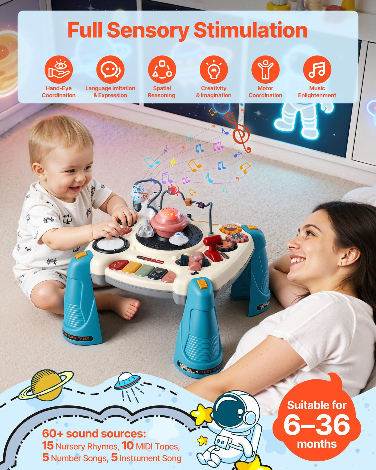 Baby sitting at a space-themed musical activity table beside an adult lying on the floor