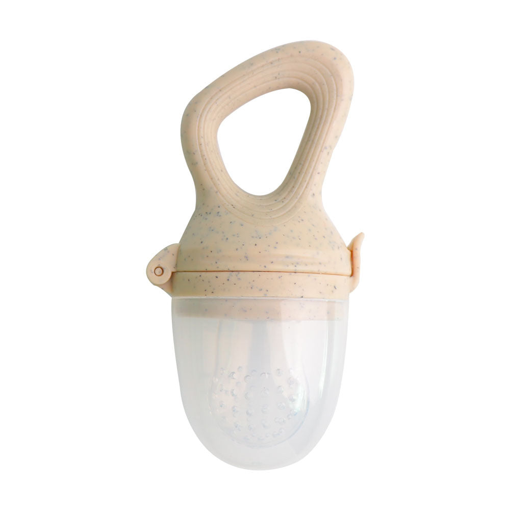 Cream baby food feeder with a loop handle and clear protective cap on a white background