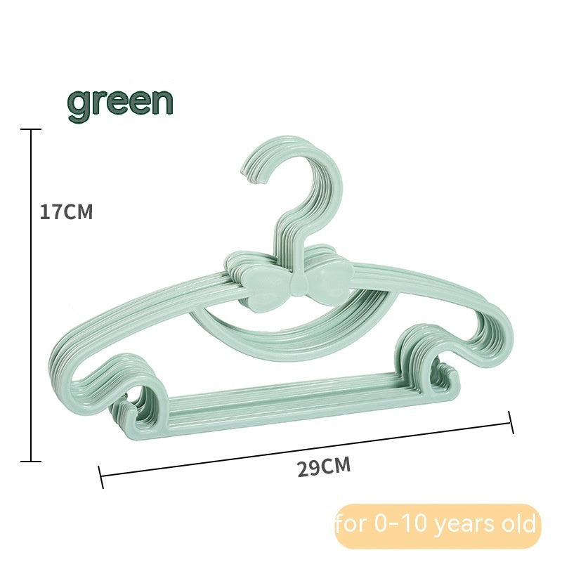 Green children's clothes hangers with bow details, showing 29 cm width and 17 cm height