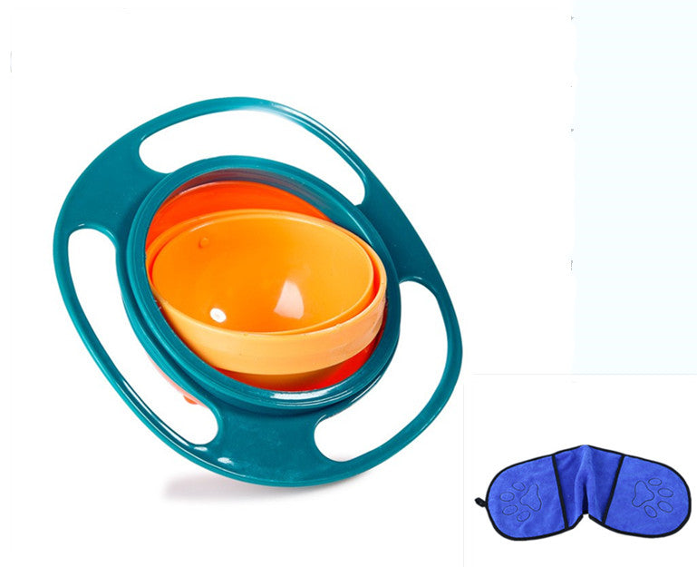 Green rotating snack bowl with an orange inner bowl beside a blue Towel
