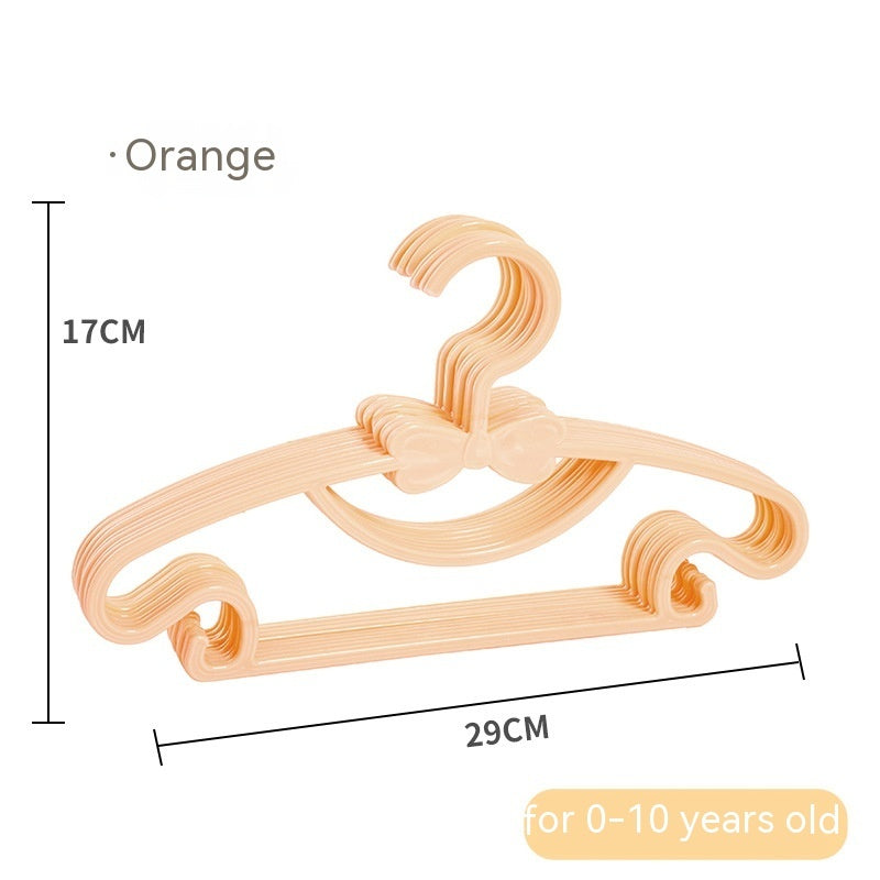 Orange children's clothes hangers with bow details, showing 29 cm width and 17 cm height