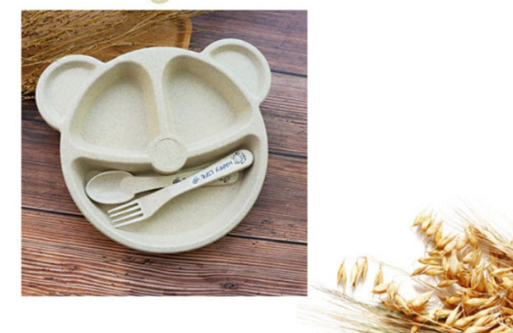 Stacked bear-shaped divided plates with a pink plate on top and matching forks and spoons