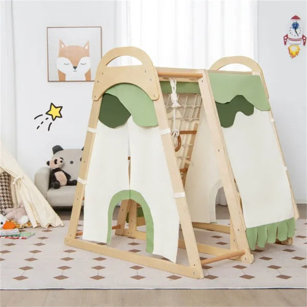 Wooden climbing gym with green and cream fabric panels arranged as a playhouse in a children's room