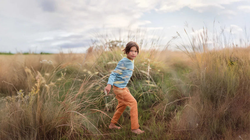  Wobakids branding with an assortment of wholesale baby and children's products, including toys, clothes, and accessories.